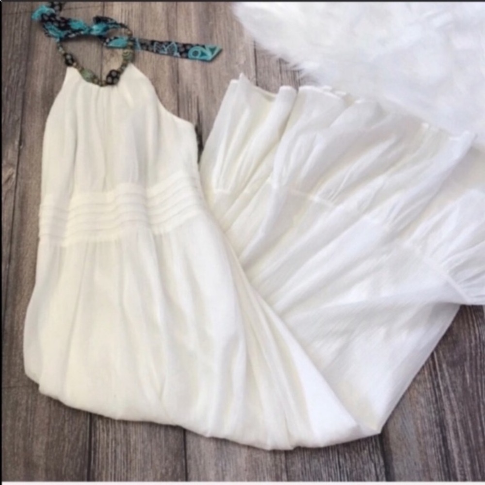 White halter style dress with ruffle hemline